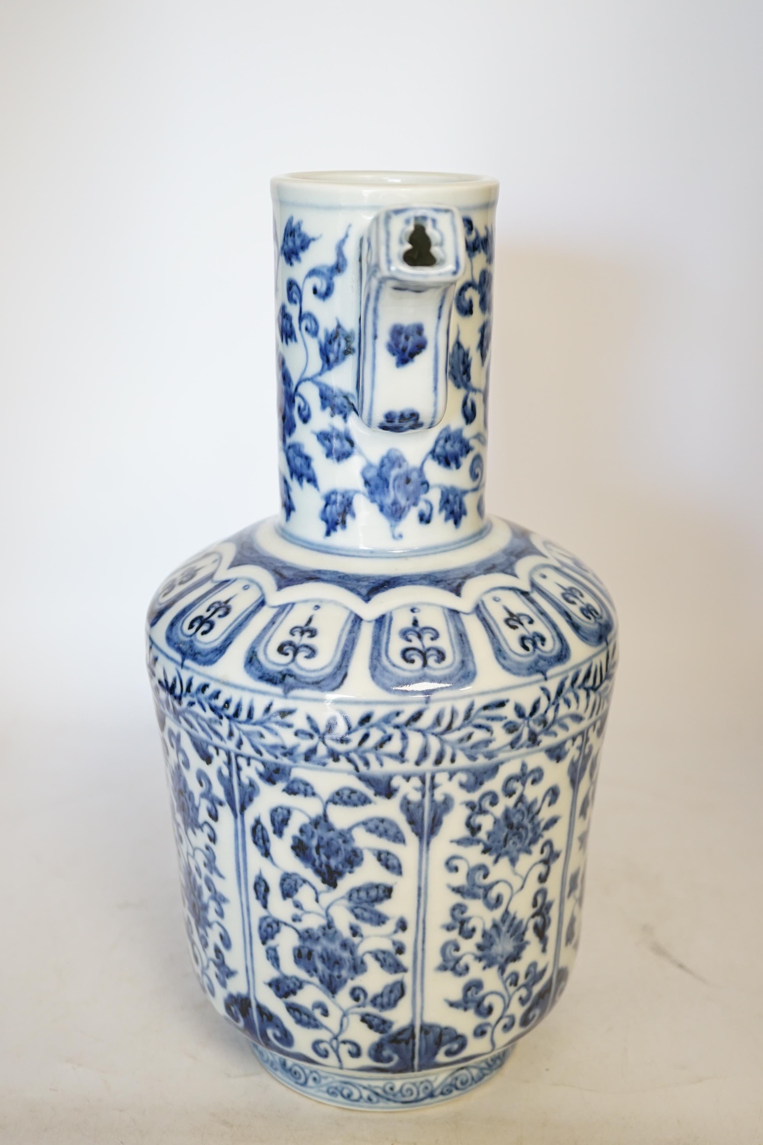 A Chinese blue and white monk’s cap ewer, 34cm high. Condition - good